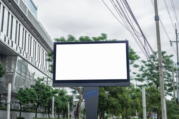 Empty billboards in Thailand Blank billboard with copy space for text or content. Simulate an empty billboard in a big city, with buildings, trees, and space for your advertisements.