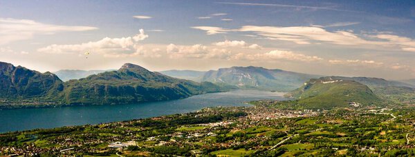 Capture the serenity of Lake du Bourget, France largest natural lake, with a breathtaking panorama from Pragondran in the Bauges Massif.