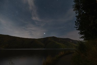 Night scene, road near mountain lake in Poland. High quality photo