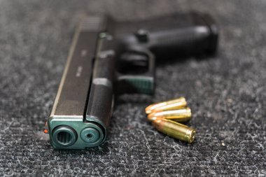 9mm pistol on the table, rifled gun barrel. High quality photo