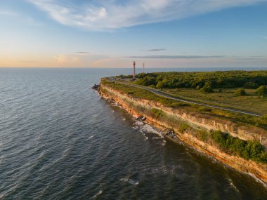 Steep shore on the north coast in Estonia in Paldiski at sunset in summer, photo from a drone. High quality photo