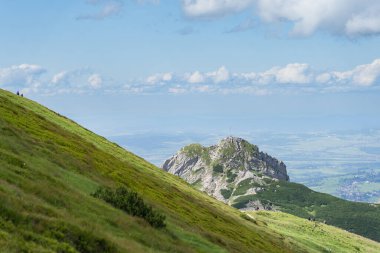 Mountain Giewont in the Tatras in Poland on a summer day, the sky is cloudy. High quality photo