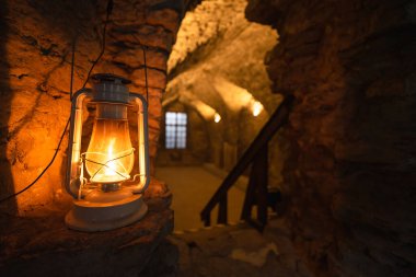Burning old oil lamp in a castle in the old town of Tallinn. High quality photo