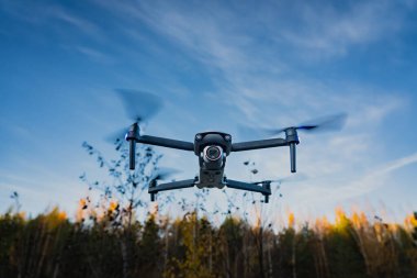 Estonia, Tallinn October 22, 2023. Autel evo lite plus drone over the autumn forest. High quality photo