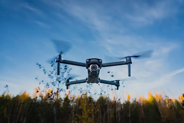 Estonia, Tallinn October 22, 2023. Autel evo lite plus drone over the autumn forest. High quality photo