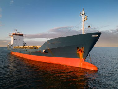 Cargo ship on the high seas, photo view from a drone.  clipart