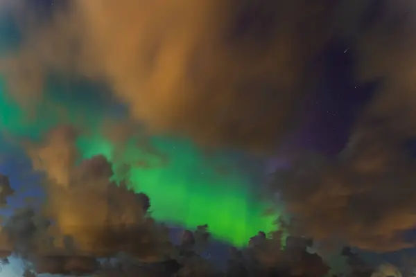 stock image Night scene, starry sky, clouds and northern lights. Nature of Estonia. 