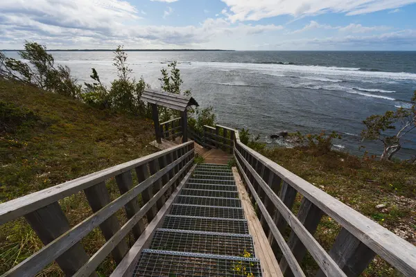 stock image Nature of Estonia, Paldiski peninsula, stairs leading from the cliff to the sea on a summer day during a storm. 