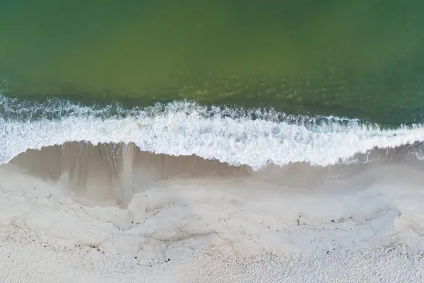 Stock image Waves on the sandy beach of Perakula on a summer morning, photo from a drone looking down.