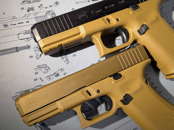 Baltics December 19, 2024. Illustrative editorial, Glock 19x and Glock 17 pistols. Close-up photo.
