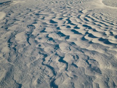 Snow Desert in Estonia. Texture of Snowy Expanse from a drone biew. Ideal background, wallpaper. clipart