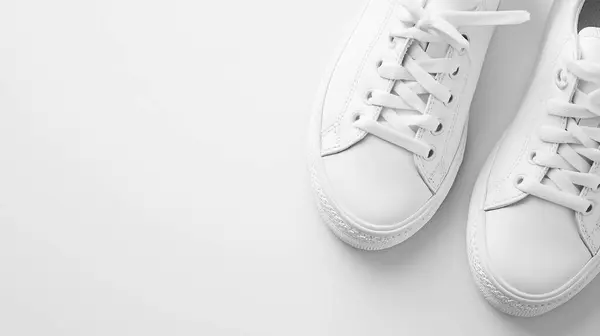 stock image Minimalist Fashion: White Sneakers on a White Canvas