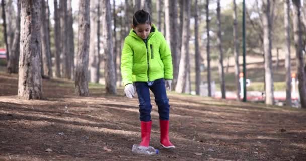Boy Picks Trash Pet Bottle Ground City Park Slow Motion — стокове відео