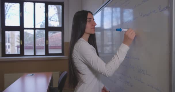 Female Teacher Writing Lecture Notes Whiteboard Classroom Slow Motion_1 — стокове відео