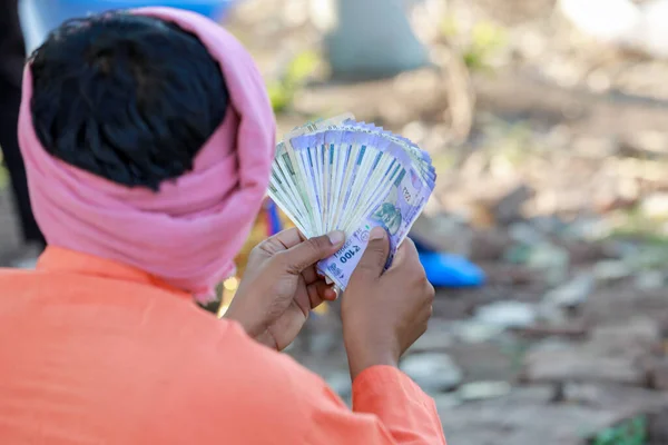 stock image Happy Indian farmer, farmer holding indian rupees in hands, smart farming