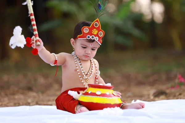 stock image happy Janmashtami , Little Indian boy posing as Shri Krishna or kanha or kanhaiya with Dahi Handi picture