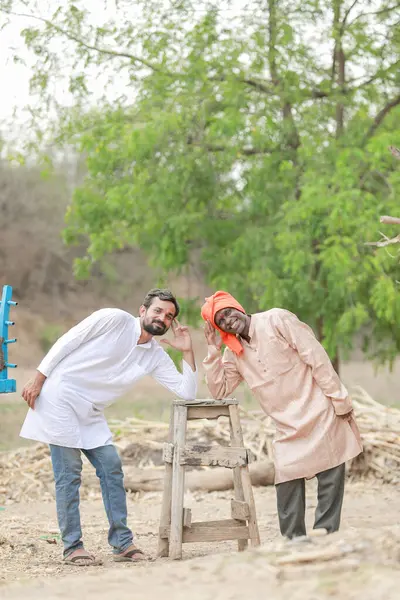 Group of two Indian male farmer, happy and funny farmers