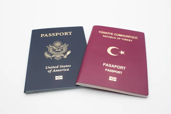 Turkish and American passports isolated on white background with clipping path