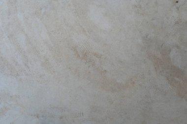 Eski gri beton duvarın dokusu. Ürününüz veya altyapınız için doğal çimento veya taş eski doku malzemesinin klasik beyaz arka planı