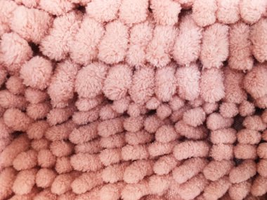 Pembe temizleme paspası ya da halı dokusu.