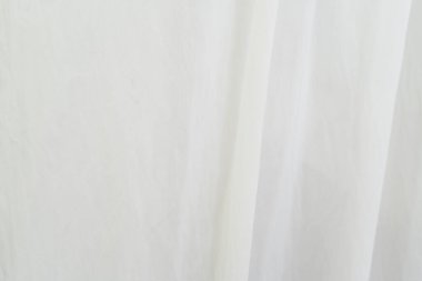 Beyaz kumaş dokusuna yakın çekim. Soyut arkaplan.