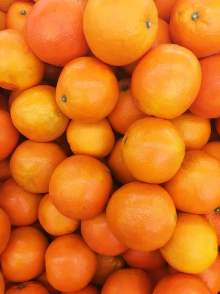 健康的なフルーツ オレンジのフルーツの背景 多くのオレンジのフルーツ スーパーマーケットのスーパーストアでオレンジのフルーツの背景 — ストック写真