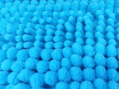 yakın plan mavi temizlik paspası veya halı dokusu.