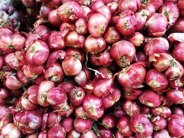 Fresh red onions. Onions background. Onions in market.