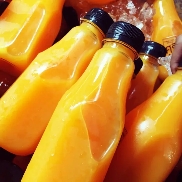 Orange juice bottle ice cold.