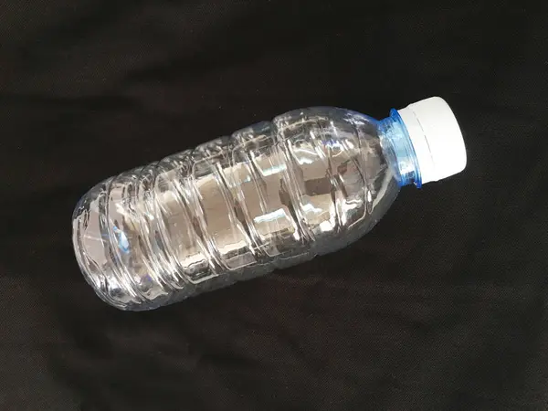 Small water bottle on black.