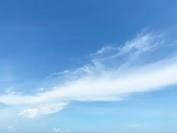 View of dense, heavy, big clouds and blue sky.