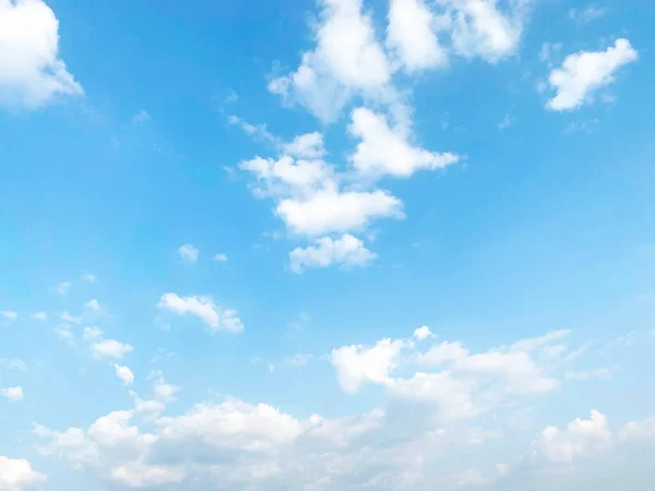 Beautiful clouds during spring time in a Sunny day. Blue sky and white fluffy clouds.