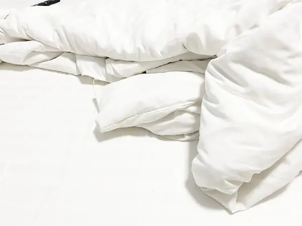 White bed linen texture. Suitable for backgrounds. Interior.