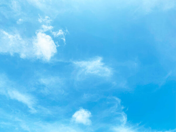Beautiful clouds during spring time in a Sunny day. Blue sky and white fluffy clouds.