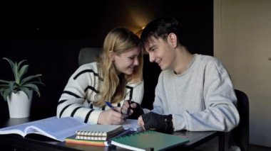 Two high school students, a boy and a girl, prepare for college lectures together. At the same time, teenagers listen to music. First love. HD.
