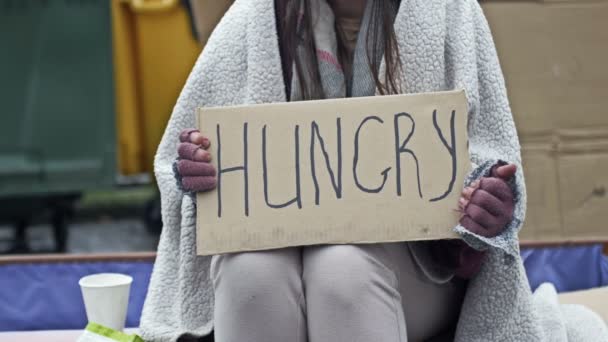 Unkempt Looking Young Woman Sits Begging Cup Holds Handwritten Hungry — Stok video