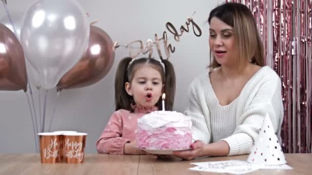 Little Girl Blows Out Candles Her Birthday Cake Her Happy — Stockvideo