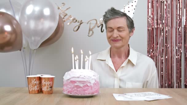 Elderly Woman Celebrates Her Birthday She Makes Wish Joyfully Blows — Stockvideo