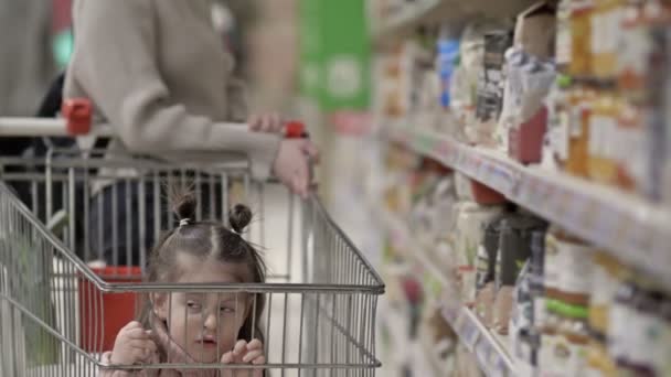Little Girl Sitting Shopping Cart — Stock Video
