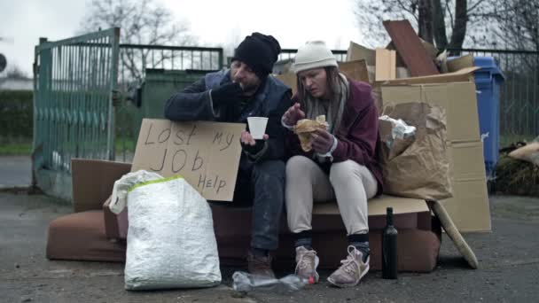 Two Dirty Poorly Dressed Homeless People Man Woman Sit Pile — Stock Video