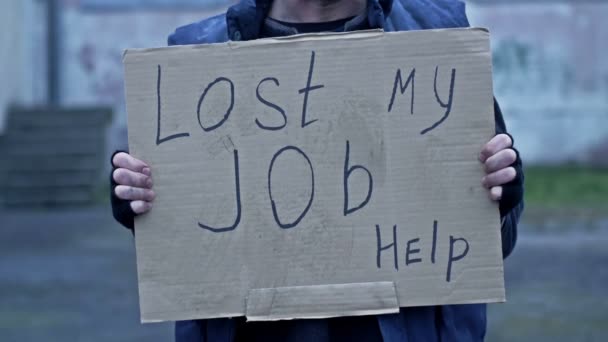Unkempt Looking Man Holds Handwritten Last Job Poster — Stock Video