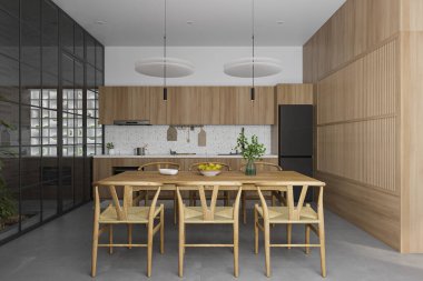 Minimalist Dining Cum Open Kitchen Interior design with wooden Furniture. Home decor