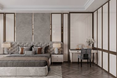 Modern yatak odasındaki yatağın yanında sandalye olan bir okuma masası..