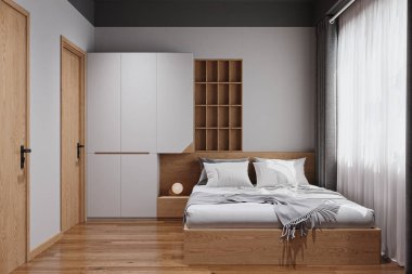 Stüdyo dairede, ahşap bir yatak odası, kabine ve ahşap döşemesi olan küçük bir yatak odası..