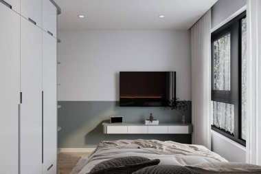 Yatak odasındaki duvarda asılı akıllı bir televizyon..