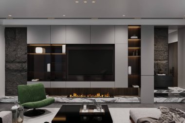 Modern oturma odasında yeşil bir koltuk, bir sehpa ve televizyonun altında bir şömine bulunuyor..