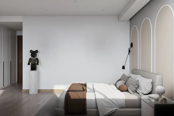 The bedroom's interior is bright, with walls painted in shades of white, gray, and cream.