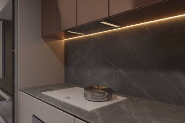 Basit modern mutfak, elektrikli ocağın üstünde bir fırın..