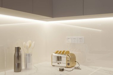 Güneş mutfak aletleri ve tost makinesiyle temiz ve düzenli mutfakta parlıyor.