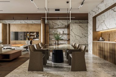 Modern yemek odası, büyük mermer bir masa ve açık mutfak yanında kahverengi sandalyeler..